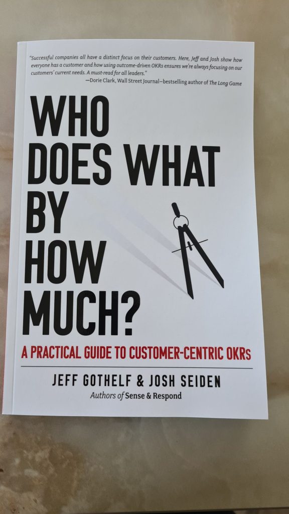 The book cover for Who does what by how much? A practical guide to OKRs.